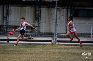 Joe Vile twisting the footy onto the checkside for a memorable ANZAC goal (Photo: www.adventurefaktory.com)